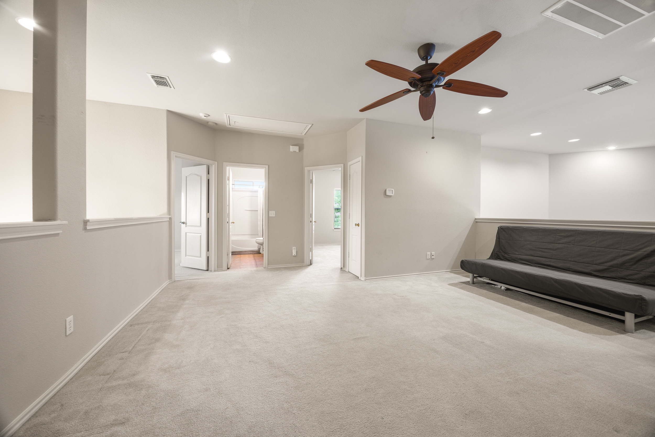Large hallway/walkway that can fit an entertainment center